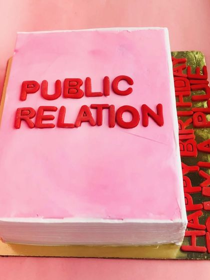 A cake for the bookworm! We designed this cake to look like a Public Relations textbook for a student's birthday, complete with a personalized message on the side.