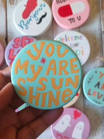 A duplicate of 82, "You are my sunshine." Our collection of quirky, hand-painted wooden magnets is perfect for spreading a little joy and love.