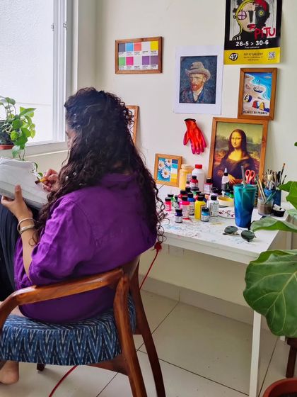 Me at work in my happy place. Surrounded by paints, brushes, and a plain white shoe ready to be transformed, this is what my everyday looks like.