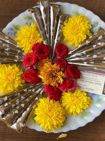 My handmade organic henna cones, ready for you. I arrange them on platters with fresh flowers for events or as special gifts, all prepared in Benson Town, Bangalore.