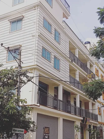 A commercial building located on a South-East corner. We specialize in analyzing and providing solutions for properties with challenging placements, such as corner plots, to maximize their positive potential.