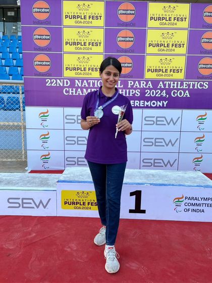 Standing proud with her medals at the National Para Athletics Championships. Every competition is a chance to prove that disability is not a barrier to achievement.