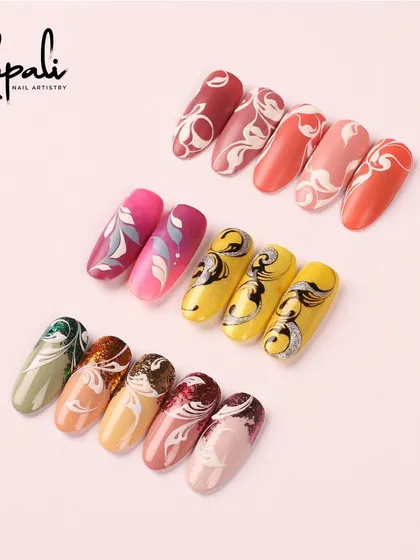 A beautiful set of ombre nails with delicate white swirl overlays.