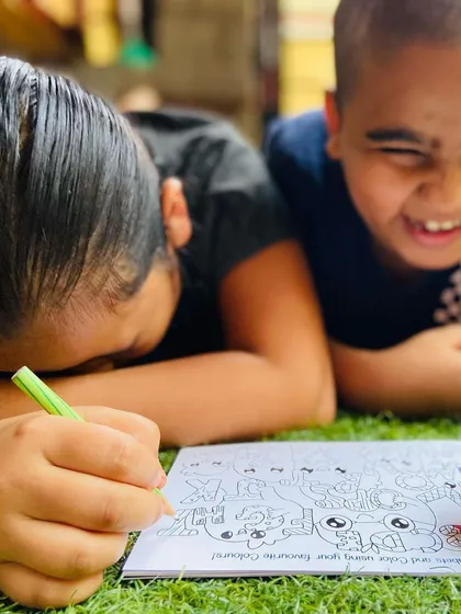 Pure, unfiltered joy. My doodle books are designed for exactly this. It's a great screen-free activity that lets kids have fun together while colouring and completing the drawings.