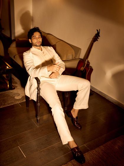 Styling Siddhant Chaturvedi for Grazia's Fashion NXT event. This all-white suit by Chandrika Raamz has a relaxed yet sharp feel, paired with loafers for a modern take on formalwear.