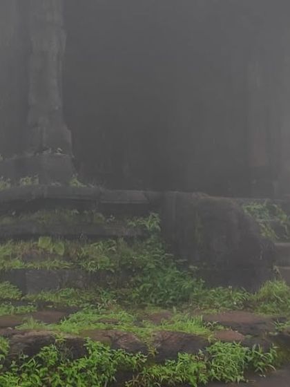 The ancient Shankara Peeta at the top of Kodachadri, shrouded in thick fog, giving it a mystical aura.