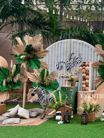 A slightly different angle of the boho jungle setup, capturing the relaxed and stylish picnic area for guests.