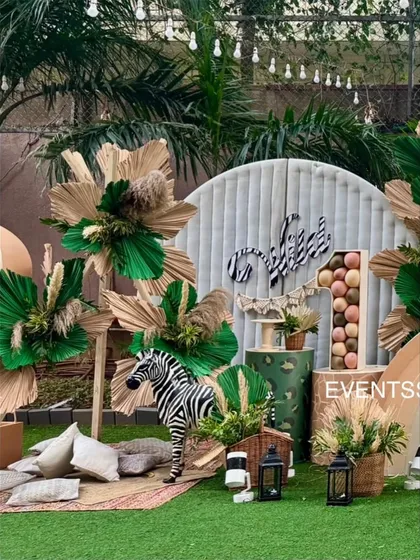 A slightly different angle of the boho jungle setup, capturing the relaxed and stylish picnic area for guests.
