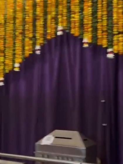 A simple yet beautiful entrance arch made entirely of yellow marigold strings. This is a classic and auspicious choice for any Indian wedding ceremony or home event.