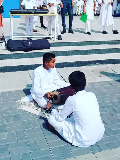 Two of our students performing on traditional percussion instruments during the Independence Day event. We embrace and teach a wide variety of musical styles and instruments.