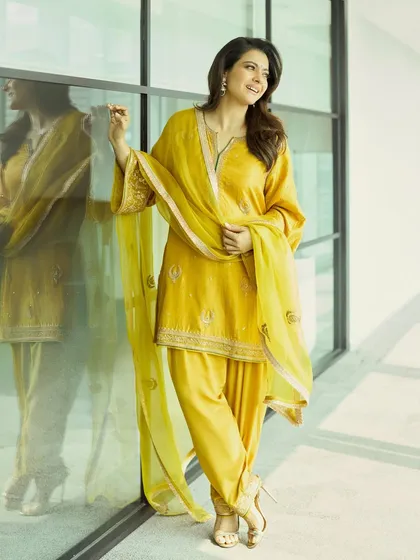 A different take on yellow, this time a classic salwar kameez set, showing versatility in festive Indian wear.