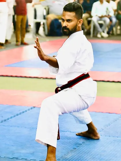 Holding a defensive posture. Competing allows me to pressure test my techniques and bring that practical knowledge back to my self-defense classes.