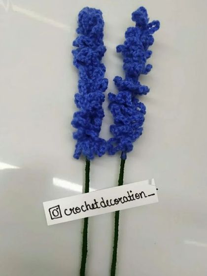 Two stems of our blue lavender flowers. These are perfect for adding height and a touch of rustic charm to your custom bouquet.