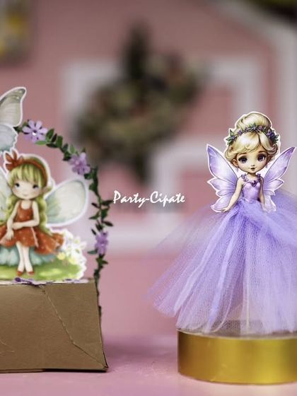 Even the smallest props get special attention. These little fairy cutouts with tulle skirts were a charming addition to the party's decor.