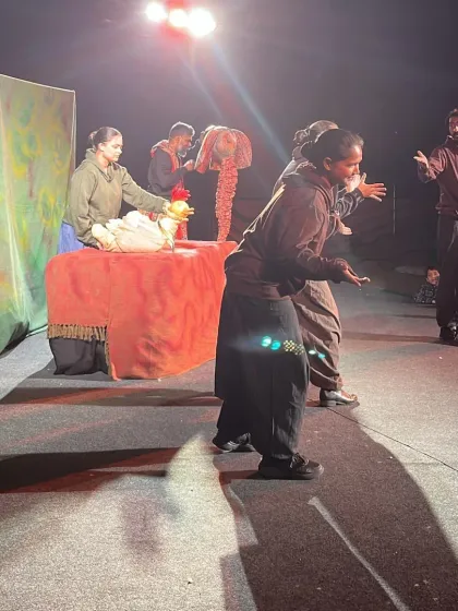 A full stage view of 'Be Yourself', showing the puppeteers in action. The performance is a blend of different puppetry styles, creating a dynamic and visually rich experience.