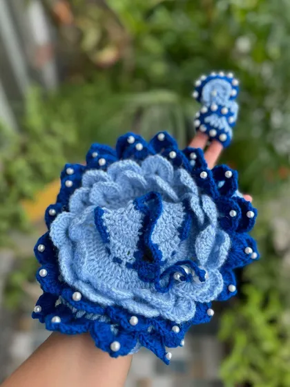 A close-up of the intricate, layered design of our blue floral Kanha Ji dress, showing the detailed craftsmanship.
