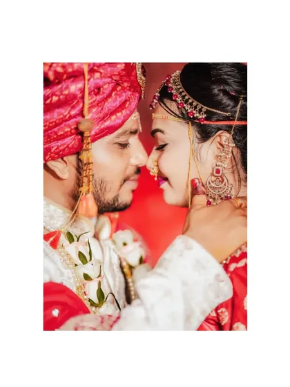 An intimate close-up of a couple, nose-to-nose, capturing the intensity and romance of their connection on their wedding day.