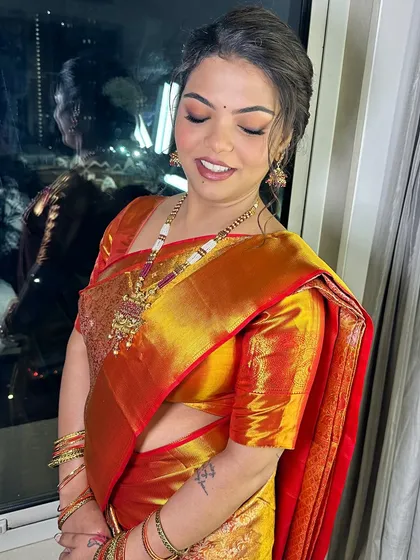The bride with her eyes closed, showcasing the beautiful and subtle eye makeup.