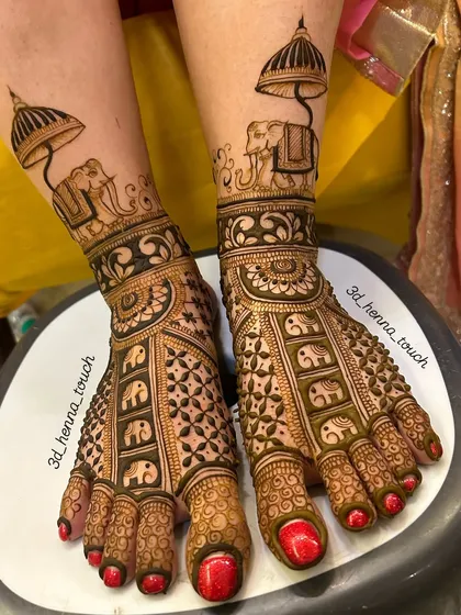 Don't forget the feet! This is an example of a full bridal foot design, with royal elephants and delicate patterns, ensuring you are adorned from head to toe on your special day.