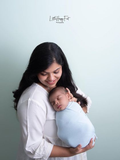 A mother's gentle embrace. This simple, elegant portrait captures the quiet, unbreakable bond between a mother and her newborn son.