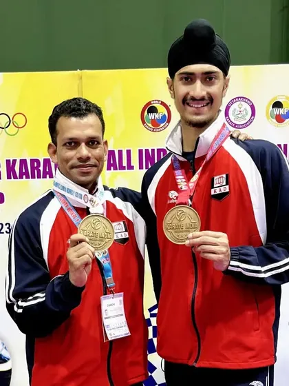 A proud moment with my coach, both of us with our medals from the Senior National Championship. We train together, we win together.