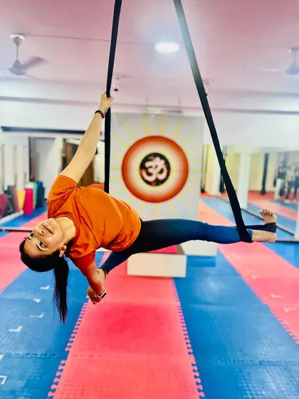A beautiful side-body stretch using the aerial hammock. This pose helps to lengthen the muscles along the side of the body and improve balance.