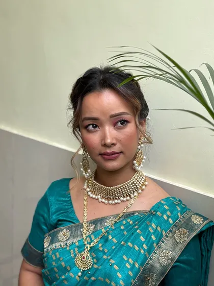 Classic gold tones and bold eyes define this elegant South Indian bridal look. Our students learn to balance tradition with modern makeup techniques for a flawless finish.