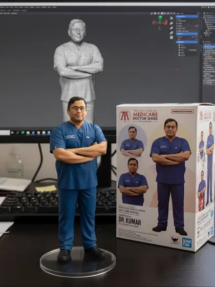 This figurine of Dr. Kumar in scrubs represents the hands-on, technical expertise of our doctors. From nano-tech in hair restoration to advanced skin treatments, our specialists are masters of their craft.