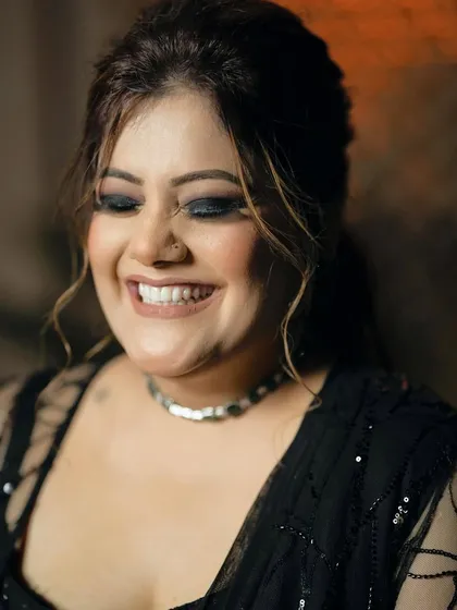 A close-up of Ishita's infectious smile, showing how comfortable and happy she is. The smokey eye is blended to perfection.