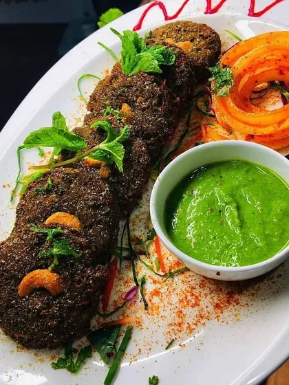 Our Hara Bhara Kabab, packed with green vegetables and spices, served with a vibrant green chutney. A healthy and delicious appetizer.