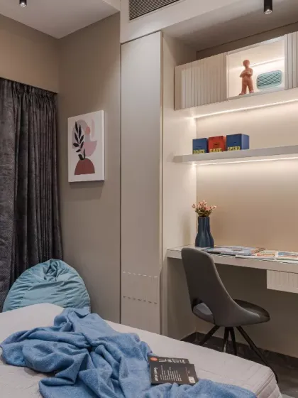 A perfect blend of functionality and aesthetics, this modern kids' bedroom is designed to inspire creativity and comfort. The sleek floating study desk with fluted detailing, illuminated shelving, and muted tones create a calming yet engaging atmosphere.
