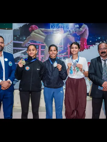 Our athletes celebrating their two silver medals at the WAKO Maharashtra State Seniors & Masters Kickboxing Championship 2024. Pictured here with officials, they represent the success of our training program.