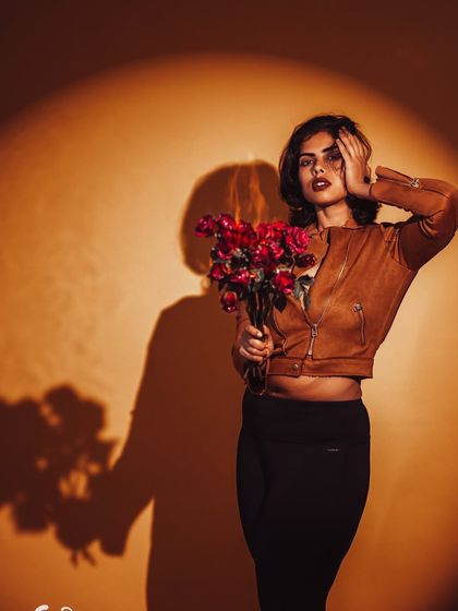 The shadow becomes a character in this conceptual portrait. The composition tells a story of duality and the inner self.