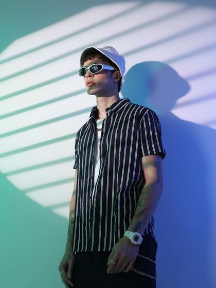 A slightly different angle of the futuristic shoot, focusing on the model's profile and the sleek lines of the sunglasses.