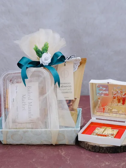 Elegant Gifting for Every Occasion. This festive hamper combines our gourmet baked goods, like Baked Masala Mathri, with traditional elements. It's a perfect example of how we create thoughtful gifts for corporate clients and loved ones alike.