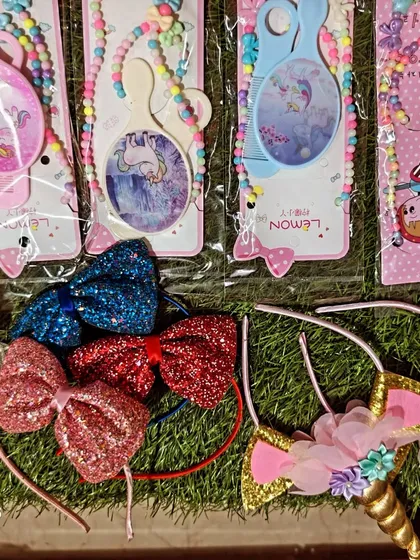 Here you can see some of my unicorn themed accessories, including glittery horn headbands and brush and bead sets. These are always a big hit at unicorn parties.
