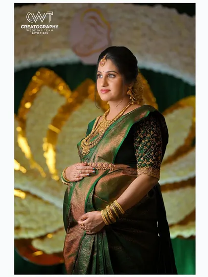 An elegant maternity portrait taken during a baby shower ceremony. We use professional lighting and posing to create stunning individual shots of the mother to be, highlighting her glow and the beautiful details of her attire.