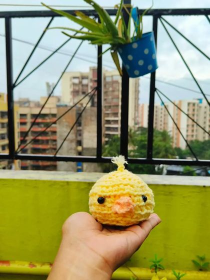 I made this cute little chick plushie. I think it would make an adorable keychain. It's a small, round ball of sunshine.