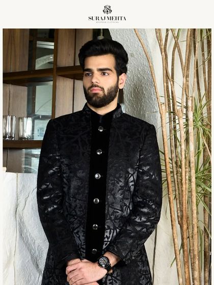 The black textured kurta, a versatile piece for any formal occasion. Its intricate details and meticulous craftsmanship ensure you exude elegance.