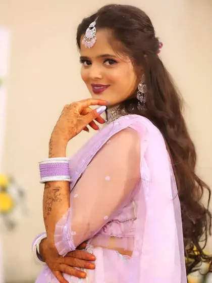 A playful and confident pose from the bride, looking over her shoulder with a smile.