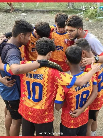The coach and team in a huddle. This is where passion meets performance.