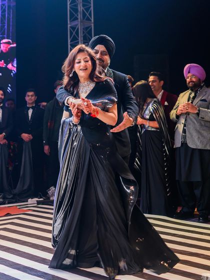 A beautiful performance by the bride's parents, full of grace and love.