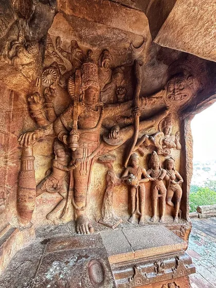An incredible sculpture of a deity carved into the rock of a temple cave, a timeless depiction of divine power and art.