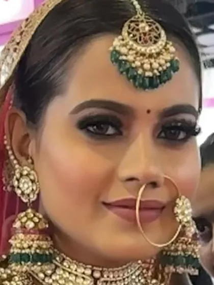 A close-up of a flawless bridal look. I focus on HD makeup that is perfect for photography, ensuring the skin looks radiant and smooth, with sharp, defined eyes and lips that complete the traditional bridal aesthetic.