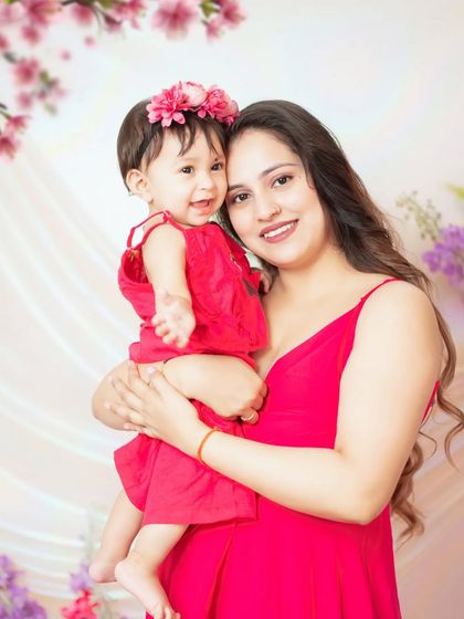 A happy mother and daughter portrait. We provide a selection of outfits for babies to match any theme or color scheme.