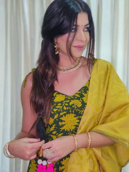 A festive look I created for Lohri. The messy fishtail braid with a colorful parandi, paired with a soft smokey eye and pink lips, is perfect for any festive celebration.