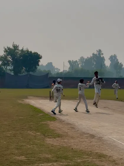 The joy of taking a wicket. The team is pumped up.