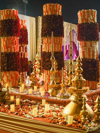 For this 'phoolon ki chowki', I designed towering columns of marigolds and carnations, surrounded by hundreds of candles and grand brass urlis to create a space that radiated devotion and grandeur.