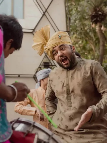 The pure joy on a guest's face as he dances to the dhol beats during the baraat.