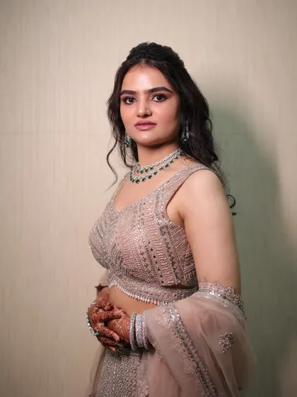 For her engagement, we went with a sophisticated soft glam look. The focus was on shimmery, defined eyes and a flawless base that photographed beautifully, letting her natural beauty shine through.